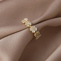 Adjustable Gold Ring with White Flowers and Zirconia